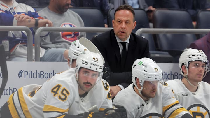 Nov 4, 2025; Elmont, New York, USA; Boston Bruins head coach Marco Sturm coaches against the New York Islanders during the second period at UBS Arena. Mandatory Credit: Brad Penner-Imagn Images