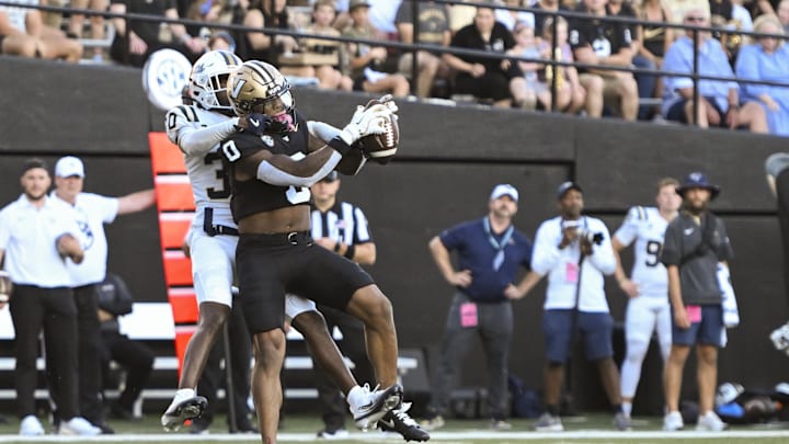 Aug 30, 2025; Nashville, Tennessee, USA; Vanderbilt Commodores wide receiver Junior Sherril (0) makes a catch over Charleston Southern Buccaneers cornerback Jayden Hancock (30) during the first half at FirstBank Stadium. Mandatory Credit: Steve Roberts-Imagn Images Aug 30, 2025; Nashville, Tennessee, USA; Vanderbilt Commodores wide receiver Junior Sherril (0) makes a catch over Charleston Southern Buccaneers cornerback Jayden Hancock (30) during the first half at FirstBank Stadium. Mandatory Credit: Steve Roberts-Imagn Images