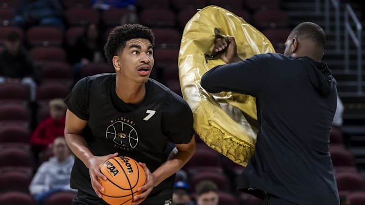 Mar 19, 2025; Wichita, KS, USA; Missouri Tigers center Trent Burns (7) maneuvers around a trainer during a practice session at Intrust Bank Arena. Mandatory Credit: Nick Tre. Smith-Imagn Images Mar 19, 2025; Wichita, KS, USA; Missouri Tigers center Trent Burns (7) maneuvers around a trainer during a practice session at Intrust Bank Arena. Mandatory Credit: Nick Tre. Smith-Imagn Images