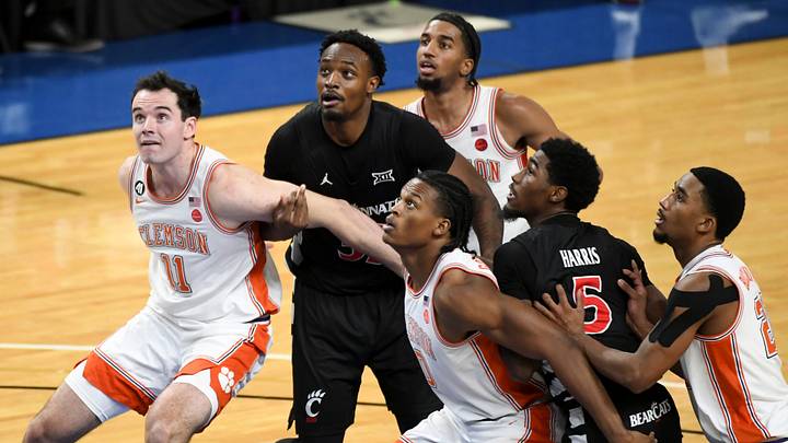 Players go for a rebound Sunday, Dec. 21, 2025, during the NCAA men’s basketball game between the Clemson Tigers and the Cincinnati Bearcats at Bon Secours Wellness Arena in Greenville, South Carolina. Clemson Tigers won 68-65.