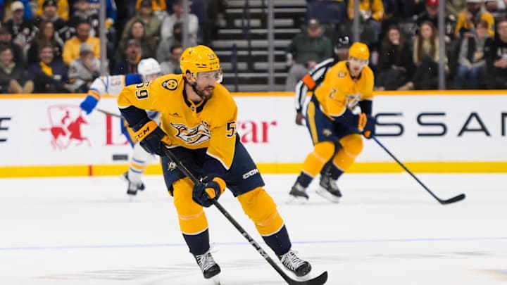Feb 8, 2025; Nashville, Tennessee, USA;  Nashville Predators defenseman Roman Josi (59) skates with the puck against the Buffalo Sabres during the first period at Bridgestone Arena. Mandatory Credit: Steve Roberts-Imagn Images