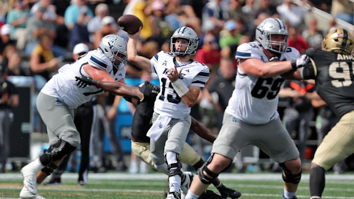 Sep 21, 2024; West Point, New York, USA; Rice Owls quarterback E.J. Warner (13) throws a touchdown pass against the Army Black Knights during the first half at Michie Stadium. Mandatory Credit: Danny Wild-Imagn Images