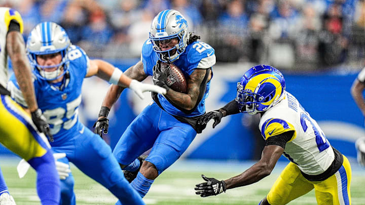 Detroit Lions running back Jahmyr Gibbs (26) runs for a first down against Los Angeles Rams cornerback Tre'Davious White (27) during the first half at Ford Field in Detroit on Sunday, September 8, 2024.