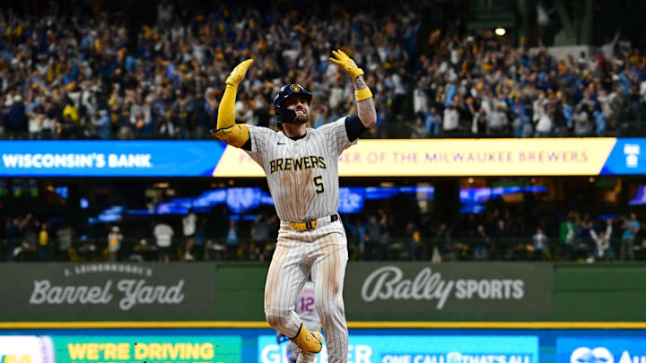 Oct 2, 2024; Milwaukee, Wisconsin, USA; Milwaukee Brewers outfielder Garrett Mitchell (5) celebrates after hitting a two-run home run during the eighth inning in game two of the Wildcard round for the 2024 MLB Playoffs against the New York Mets at American Family Field. Mandatory Credit: Benny Sieu-Imagn Images