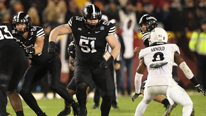 Nov 16, 2024; Ames, Iowa, USA; Iowa State Cyclones offensive lineman Brendan Black (51) blocks for the Cyclones offense against the Cincinnati Bearcats at Jack Trice Stadium. The Iowa State Cyclones won the game 34-17.  