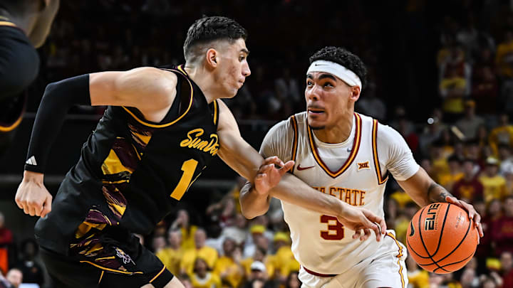 Mar 7, 2026; Ames, Iowa, USA; Iowa State Cyclones guard Tamin Lipsey (3) goes to the basket as Arizona State Sun Devils forward Andrija Grbovic (14) defends during the first half at James H. Hilton Coliseum. Mandatory Credit: Jeffrey Becker-Imagn Images