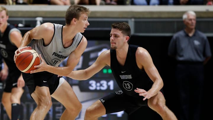 Purdue Boilermakers Camden Heide (23) defends Brian Waddell (11) during the alumni game . Purdue Boilermakers Camden Heide (23) defends Brian Waddell (11) during the alumni game .