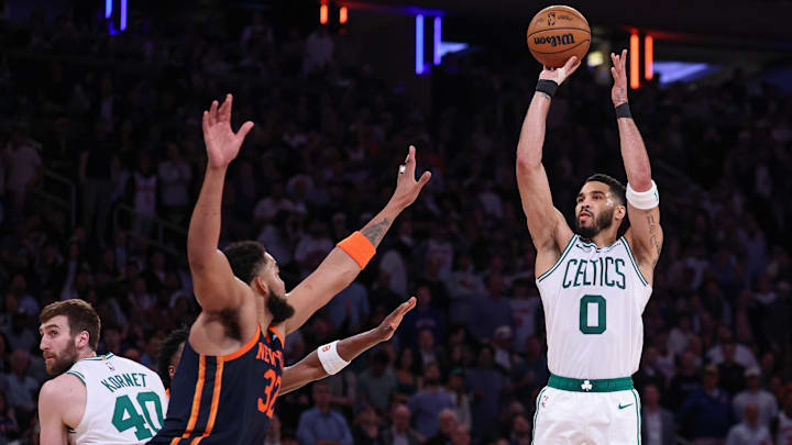 May 12, 2025; New York, New York, USA; Boston Celtics forward Jayson Tatum (0) shoots the ball as New York Knicks center Karl-Anthony Towns (32) defends in the second half during game four of the second round for the 2025 NBA Playoffs at Madison Square Garden. Mandatory Credit: Vincent Carchietta-Imagn Images