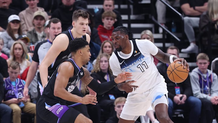 Feb 28, 2025; Salt Lake City, Utah, USA; Minnesota Timberwolves center Naz Reid (11) drives against Utah Jazz forward KJ Martin (99) and center Walker Kessler (24) during the second quarter at Delta Center. Mandatory Credit: Rob Gray-Imagn Images Feb 28, 2025; Salt Lake City, Utah, USA; Minnesota Timberwolves center Naz Reid (11) drives against Utah Jazz forward KJ Martin (99) and center Walker Kessler (24) during the second quarter at Delta Center. Mandatory Credit: Rob Gray-Imagn Images