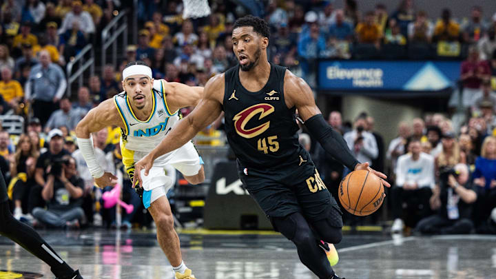 Donovan Mitchell, now engaged to Coco Jones, dribbles the ball during a playoff game against the Pacers.