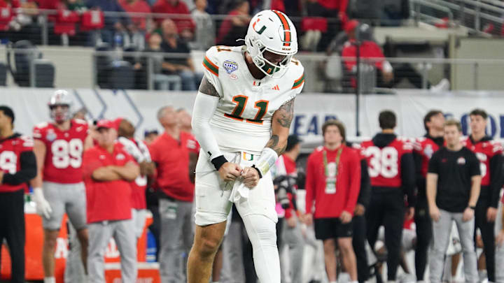 Dec 31, 2025; Arlington, TX, USA; Miami Hurricanes quarterback Carson Beck (11) reacts after a successful pass in the fourth quarter against the Ohio State Buckeyes during the 2025 Cotton Bowl and quarterfinal game of the College Football Playoff at AT&T Stadium. Mandatory Credit: Raymond Carlin III-Imagn Images