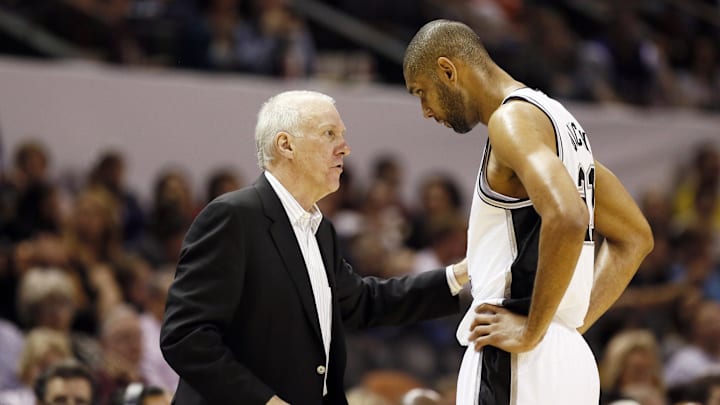 Apr 12, 2013; San Antonio, TX, USA; San Antonio Spurs head coach Gregg Popovich talks to Tim Duncan