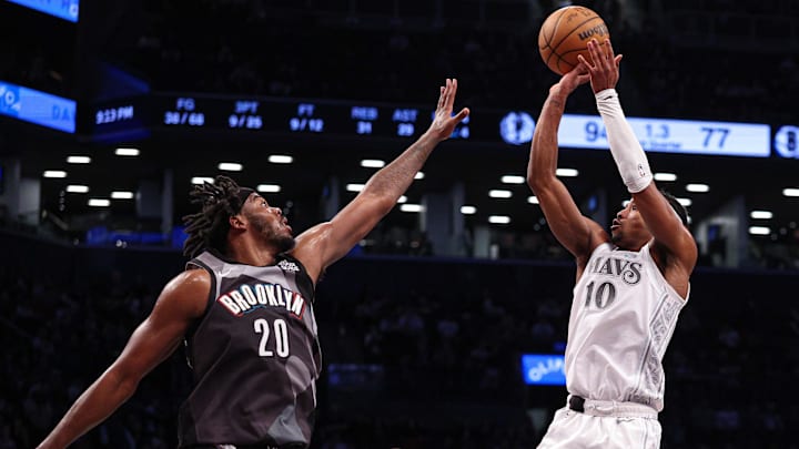 Mar 24, 2025; Brooklyn, New York, USA; Dallas Mavericks guard Brandon Williams (10) shoots the ball against Brooklyn Nets center Day'Ron Sharpe (20) during the second half at Barclays Center. Mandatory Credit: Vincent Carchietta-Imagn Images Mar 24, 2025; Brooklyn, New York, USA; Dallas Mavericks guard Brandon Williams (10) shoots the ball against Brooklyn Nets center Day'Ron Sharpe (20) during the second half at Barclays Center. Mandatory Credit: Vincent Carchietta-Imagn Images