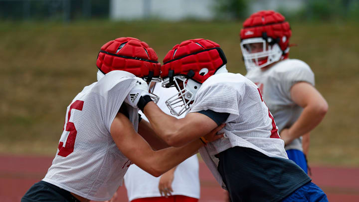 Nixa High School freshman Jackson Cantwell (right) runs drills during football practice on Tuesday, July 12, 2022. Cantwell is 6-foot-8 and a multi-sport athlete and also scored a 33 on the ACT.

Tnixa Football00062