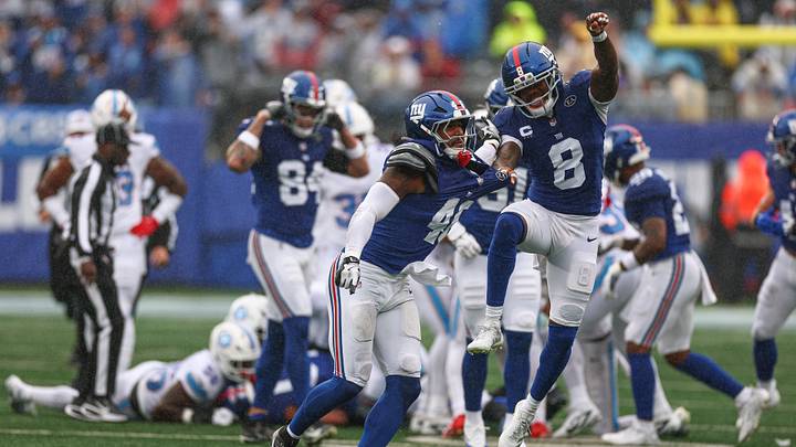 Sep 27, 2026; East Rutherford, New Jersey, USA; New York Giants linebacker Zaire Barnes (46) and safety Jevon Holland (8) celebrates after a turnover during the first half against the Tennessee Titans at MetLife Stadium. Mandatory Credit: Vincent Carchietta-Imagn Images