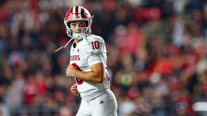 Oct 3, 2026; Piscataway, New Jersey, USA; Indiana Hoosiers quarterback Josh Hoover (10) looks back after throwing a touchdown pass during the first half against the Rutgers Scarlet Knights at SHI Stadium. Mandatory Credit: Vincent Carchietta-Imagn Images Oct 3, 2026; Piscataway, New Jersey, USA; Indiana Hoosiers quarterback Josh Hoover (10) looks back after throwing a touchdown pass during the first half against the Rutgers Scarlet Knights at SHI Stadium. Mandatory Credit: Vincent Carchietta-Imagn Images