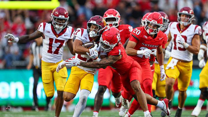 Sep 19, 2026; Piscataway, New Jersey, USA;  USC Trojans running back Riley Wormley (27) carries the ball as Rutgers Scarlet Knights defensive back Kaj Sanders (1) tackles pursues during the second half at SHI Stadium. Mandatory Credit: Vincent Carchietta-Imagn Images