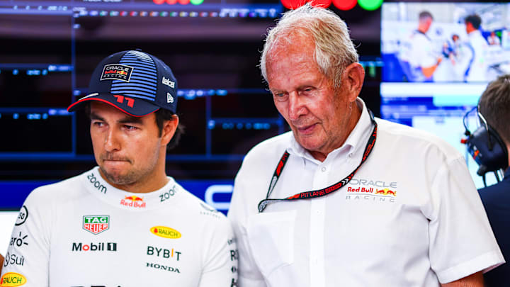 Sergio Perez of Mexico and Oracle Red Bull Racing and Oracle Red Bull Racing Team Consultant Dr Helmut Marko look on in the garage prior to Sprint Qualifying ahead of the F1 Grand Prix of Austria at Red Bull Ring on June 28, 2024 in Spielberg, Austria. 