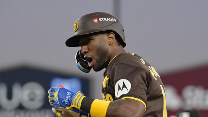Oct 6, 2024; Los Angeles, California, USA; San Diego Padres outfielder Jurickson Profar (10) reacts at first base after bunting in the sixth inning against the Los Angeles Dodgers during game two of the NLDS for the 2024 MLB Playoffs at Dodger Stadium. Mandatory Credit: Jayne Kamin-Oncea-Imagn Images Oct 6, 2024; Los Angeles, California, USA; San Diego Padres outfielder Jurickson Profar (10) reacts at first base after bunting in the sixth inning against the Los Angeles Dodgers during game two of the NLDS for the 2024 MLB Playoffs at Dodger Stadium. Mandatory Credit: Jayne Kamin-Oncea-Imagn Images