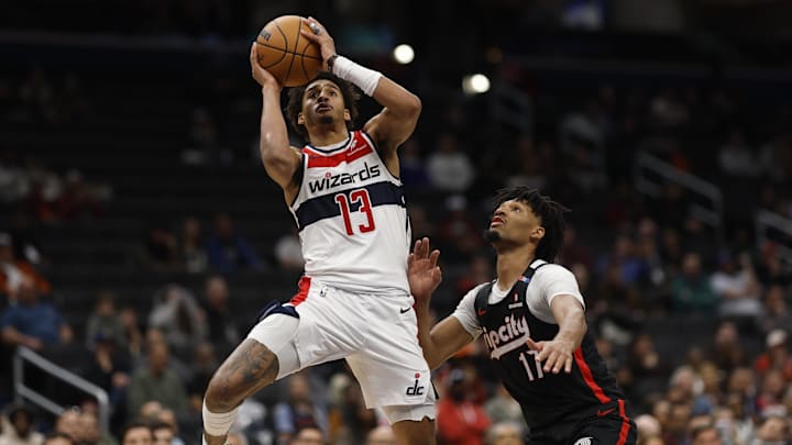 Feb 26, 2025; Washington, District of Columbia, USA; Washington Wizards guard Jordan Poole (13) shoots the ball as Portland Trail Blazers guard Shaedon Sharpe (17) defends in the second half at Capital One Arena. Mandatory Credit: Geoff Burke-Imagn Images