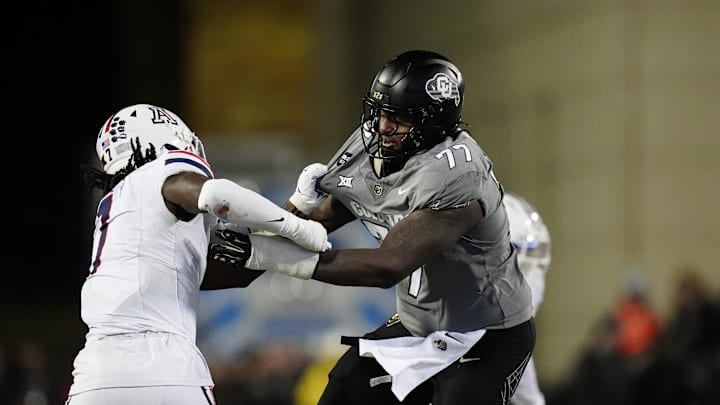 Nov 1, 2025; Boulder, Colorado, USA; Colorado Buffaloes offensive lineman Jordan Seaton (77) and Arizona Wildcats linebacker Chase Kennedy (7) during the second half at Folsom Field. Mandatory Credit: Ron Chenoy-Imagn Images Nov 1, 2025; Boulder, Colorado, USA; Colorado Buffaloes offensive lineman Jordan Seaton (77) and Arizona Wildcats linebacker Chase Kennedy (7) during the second half at Folsom Field. Mandatory Credit: Ron Chenoy-Imagn Images