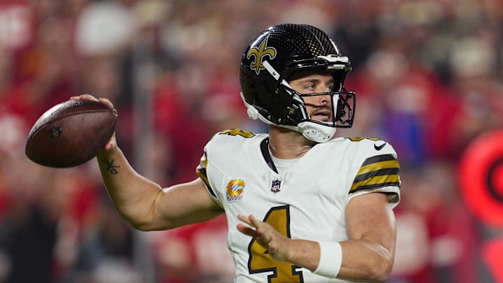 Oct 7, 2024; Kansas City, Missouri, USA; New Orleans Saints quarterback Derek Carr (4) throws a pass during the first half against the Kansas City Chiefs at GEHA Field at Arrowhead Stadium. Mandatory Credit: Jay Biggerstaff-Imagn Images
