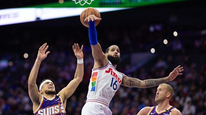 Jan 6, 2025; Philadelphia, Pennsylvania, USA; Phoenix Suns guard Devin Booker (1) looses control of the ball while driving against Philadelphia 76ers forward Caleb Martin (16) during the third quarter at Wells Fargo Center. Mandatory Credit: Bill Streicher-Imagn Images Jan 6, 2025; Philadelphia, Pennsylvania, USA; Phoenix Suns guard Devin Booker (1) looses control of the ball while driving against Philadelphia 76ers forward Caleb Martin (16) during the third quarter at Wells Fargo Center. Mandatory Credit: Bill Streicher-Imagn Images