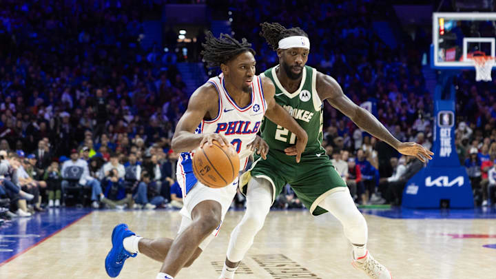 Feb 25, 2024; Philadelphia, Pennsylvania, USA; Philadelphia 76ers guard Tyrese Maxey (0) dribbles past Milwaukee Bucks guard Patrick Beverley (21) during the fourth quarter at Wells Fargo Center. Mandatory Credit: Bill Streicher-Imagn Images