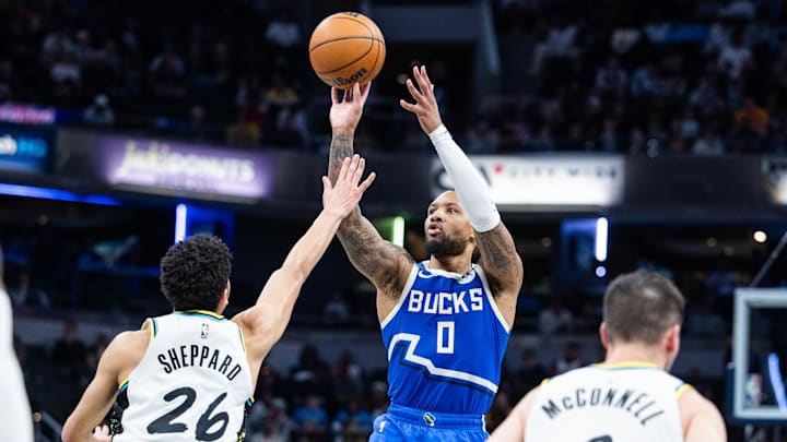 Mar 11, 2025; Indianapolis, Indiana, USA: Milwaukee Bucks guard Damian Lillard (0) shoots the ball while Indiana Pacers guard Ben Sheppard (26) defends in the second half  at Gainbridge Fieldhouse. Mandatory Credit: Trevor Ruszkowski-Imagn Images