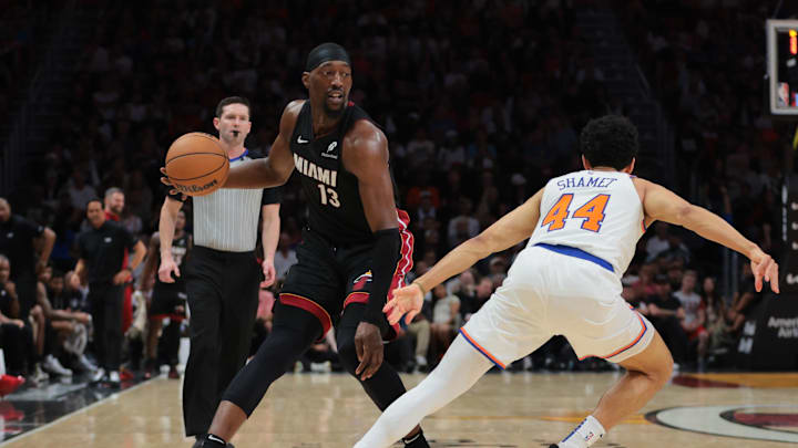 Mar 2, 2025; Miami, Florida, USA; Miami Heat center Bam Adebayo (13) dribbles the basketball as New York Knicks guard Landry Shamet (44) defends during the fourth quarter at Kaseya Center. Mandatory Credit: Sam Navarro-Imagn Images