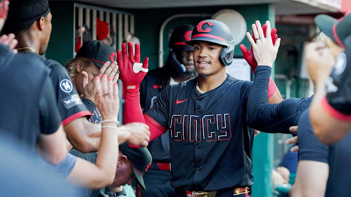 Cincinnati Reds third baseman Noelvi Marte (16) is embraced by his team after hitting a home run in the third inning of a MLB game between the Cincinnati Reds and Colorado Rockies, Friday, July 11, 2025, at Great American Ball Park in Downtown Cincinnati.