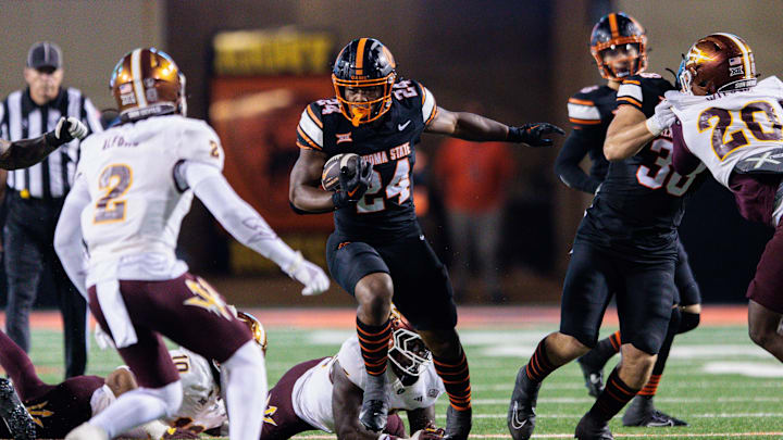 Nov 2, 2024; Stillwater, Oklahoma, USA; Oklahoma State Cowboys running back Trent Howland (24) runs the ball during the third quarter against the Arizona State Sun Devils at Boone Pickens Stadium. Mandatory Credit: William Purnell-Imagn Images Nov 2, 2024; Stillwater, Oklahoma, USA; Oklahoma State Cowboys running back Trent Howland (24) runs the ball during the third quarter against the Arizona State Sun Devils at Boone Pickens Stadium. Mandatory Credit: William Purnell-Imagn Images