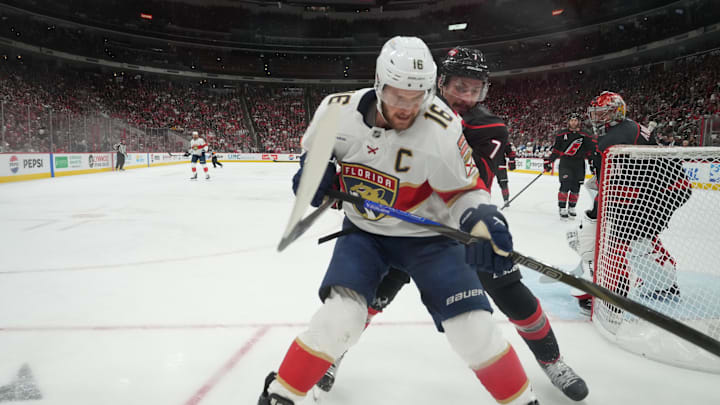 The Hurricanes' Dmitry Orlov and Aleksander Barkov battle for the puck during the Eastern Conference final. The Hurricanes' Dmitry Orlov and Aleksander Barkov battle for the puck during the Eastern Conference final.