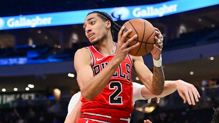 Oct 14, 2026; Milwaukee, Wisconsin, USA;  Chicago Bulls forward Noa Essengue (2) grabs a rebound against Milwaukee Bucks guard Brayden Burries (0) in the fourth quarter at Fiserv Forum.  Mandatory Credit: Benny Sieu-Imagn Images