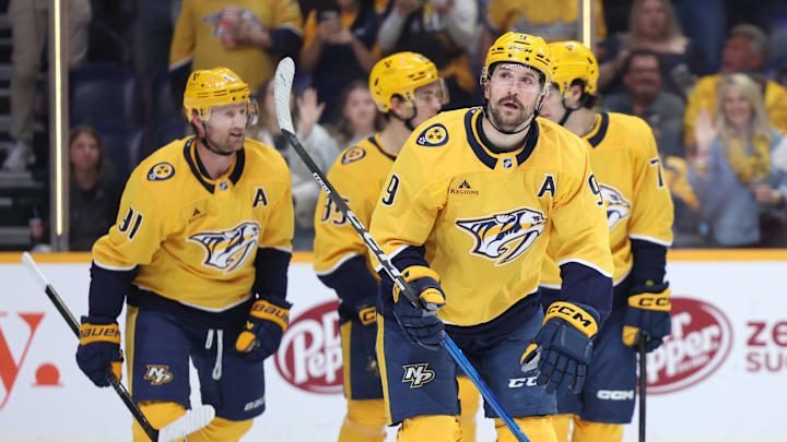 Apr 16, 2026; Nashville, Tennessee, USA; Nashville Predators left wing Filip Forsberg (9) regroups with his team after scoring a goal during the first period of their game against the Anaheim Ducks at Bridgestone Arena. Mandatory Credit: Alan Poizner-Imagn Images