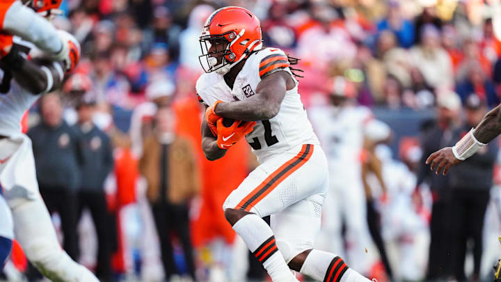 Nov 26, 2023; Denver, Colorado, USA; Cleveland Browns running back Kareem Hunt (27) carries the ball in the second quarter against the Denver Broncos at Empower Field at Mile High.