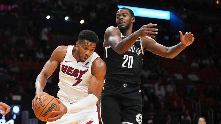 Oct 14, 2026; Miami, Florida, USA; Miami Heat forward Giannis Antetokounmpo (7) grabs a rebound away from Brooklyn Nets center Day'ron Sharpe (20) during the first half at Kaseya Center. Mandatory Credit: Jim Rassol-Imagn Images Oct 14, 2026; Miami, Florida, USA; Miami Heat forward Giannis Antetokounmpo (7) grabs a rebound away from Brooklyn Nets center Day'ron Sharpe (20) during the first half at Kaseya Center. Mandatory Credit: Jim Rassol-Imagn Images