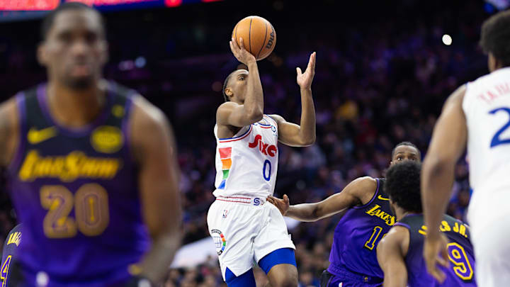 Jan 28, 2025; Philadelphia, Pennsylvania, USA; Philadelphia 76ers guard Tyrese Maxey (0) drives for a shot against the Los Angeles Lakers during the fourth quarter at Wells Fargo Center. Mandatory Credit: Bill Streicher-Imagn Images