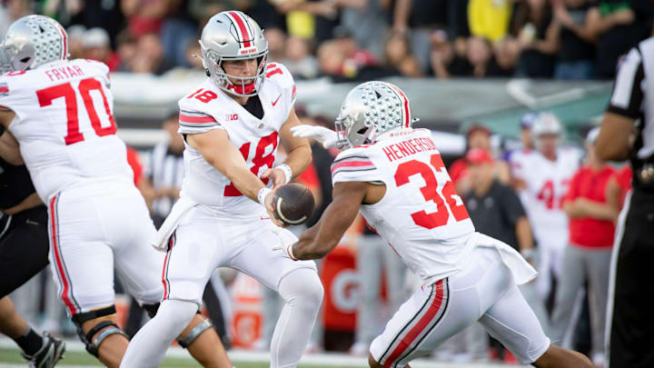 Ohio State Buckeyes quarterback Will Howard hands off the ball to Ohio State Buckeyes running back TreVeyon Henderson as the No. 3 Oregon Ducks host the No. 2 Ohio State Buckeyes Saturday, Oct. 12, 2024 at Autzen Stadium in Eugene, Ore.