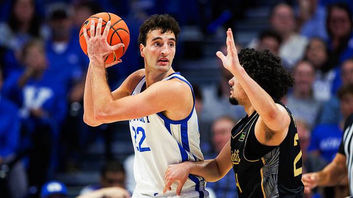 Oct 28, 2026; Lexington, KY, USA; Kentucky Wildcats forward Milan Momcilovic (22) handles the ball against UCF Knights guard Carmelo Pacheco (24) during the first half at Rupp Arena Central Bank Center. Mandatory Credit: Jordan Prather-Imagn Images Oct 28, 2026; Lexington, KY, USA; Kentucky Wildcats forward Milan Momcilovic (22) handles the ball against UCF Knights guard Carmelo Pacheco (24) during the first half at Rupp Arena Central Bank Center. Mandatory Credit: Jordan Prather-Imagn Images