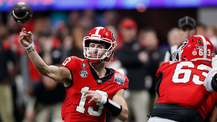 Georgia quarterback Stetson Bennett (13) throws a pass during the second half of the Chick-fil-A Peach Bowl NCAA College Football Playoff semifinal game between Ohio State and Georgia on Saturday, Dec 31, 2022, in Atlanta. Georgia won 42-41.