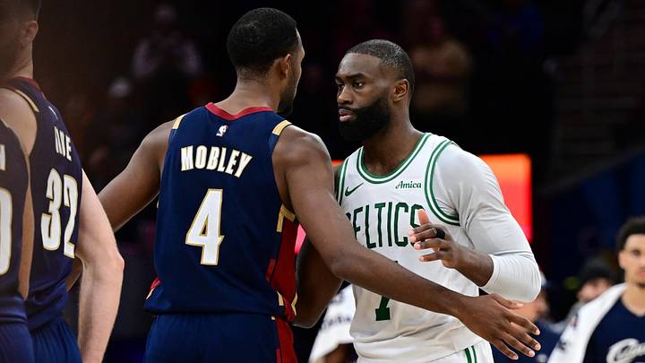 Nov 30, 2025; Cleveland, Ohio, USA; Boston Celtics guard Jaylen Brown (7) and Cleveland Cavaliers center Evan Mobley (4) embrace after a game at Rocket Arena. Mandatory Credit: David Dermer-Imagn Images