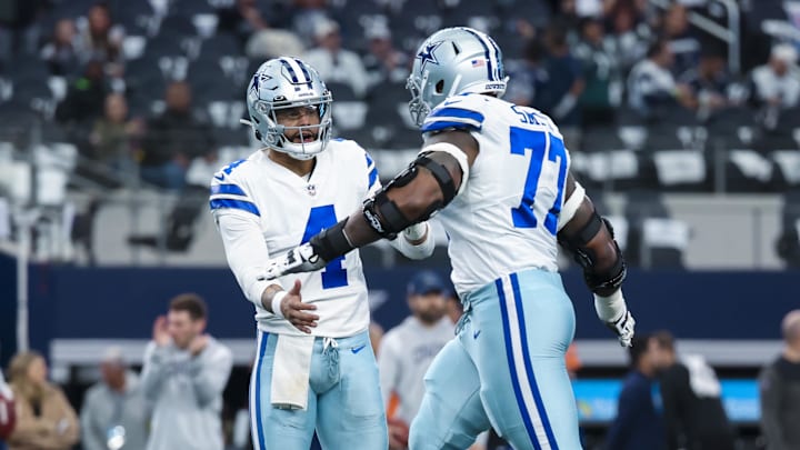 Dec 24, 2022; Arlington, Texas, USA;  Dallas Cowboys quarterback Dak Prescott (4) greets offensive