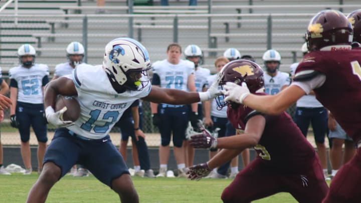 Christ Church football vs. Woodruff in McDonald's Kick-Off Classic at Chapman. Christ Church running back Michael Martin II with the push-off. Christ Church football vs. Woodruff in McDonald's Kick-Off Classic at Chapman. Christ Church running back Michael Martin II with the push-off.