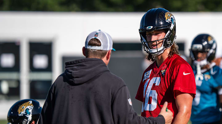 Jacksonville Jaguars offensive coordinator Grant Udinski talks with Jacksonville Jaguars quarterback Trevor Lawrence (16) between drills during an NFL training camp second session at the Miller Electric Center, Thursday, July 24, 2025, in Jacksonville, Fla. [Doug Engle/Florida Times-Union]