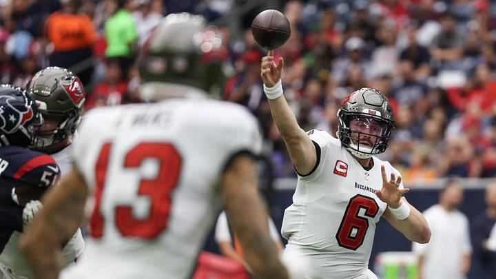 Nov 5, 2023; Houston, Texas, USA; Tampa Bay Buccaneers quarterback Baker Mayfield (6) passes to wide receiver Mike Evans (13) against the Houston Texans in the first quarter at NRG Stadium. Mandatory Credit: Thomas Shea-Imagn Images