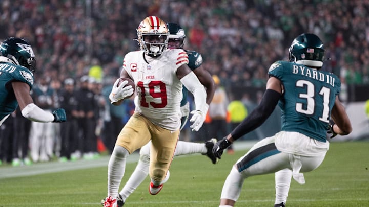 Dec 3, 2023; Philadelphia, Pennsylvania, USA; San Francisco 49ers wide receiver Deebo Samuel (19) runs with the ball against Philadelphia Eagles safety Kevin Byard (31) after a catch during the second quarter at Lincoln Financial Field. Mandatory Credit: Bill Streicher-Imagn Images