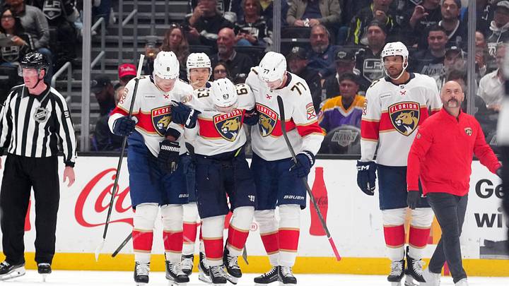 Oct 6, 2026; Los Angeles, California, USA;  Florida Panthers left wing Brad Marchand (63) is helped off the ice by left wing Brady Tkachuk (8) and defenseman Niko Mikkola (77) in the third period after an injury against the LA Kings at Crypto.com Arena. Mandatory Credit: Kirby Lee-Imagn Images