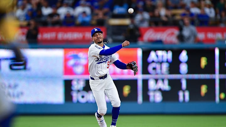 Jul 18, 2025; Los Angeles, California, USA; Los Angeles Dodgers shortstop Mookie Betts (50) throws to first for the out against Milwaukee Brewers catcher William Contreras (24) during the ninth inning at Dodger Stadium. Mandatory Credit: Gary A. Vasquez-Imagn Images Jul 18, 2025; Los Angeles, California, USA; Los Angeles Dodgers shortstop Mookie Betts (50) throws to first for the out against Milwaukee Brewers catcher William Contreras (24) during the ninth inning at Dodger Stadium. Mandatory Credit: Gary A. Vasquez-Imagn Images