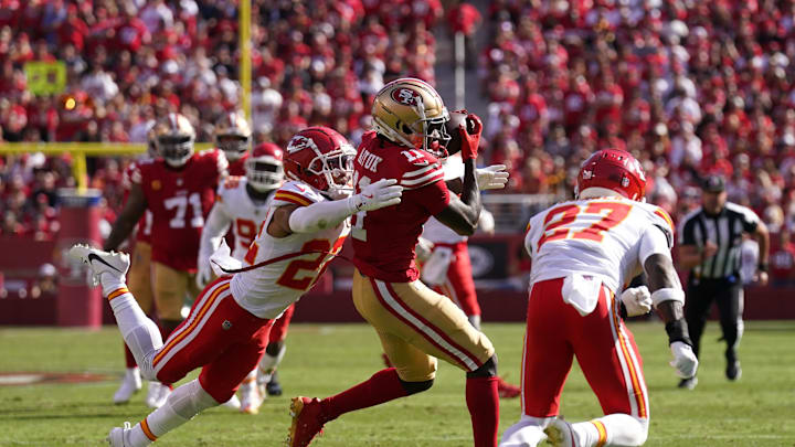 Oct 20, 2024; Santa Clara, California, USA; San Francisco 49ers wide receiver Brandon Aiyuk (11) catches a pass between Kansas City Chiefs cornerback Trent McDuffie (22) and safety Chamarri Conner (27) in the second quarter at Levi's Stadium. Mandatory Credit: Cary Edmondson-Imagn Images